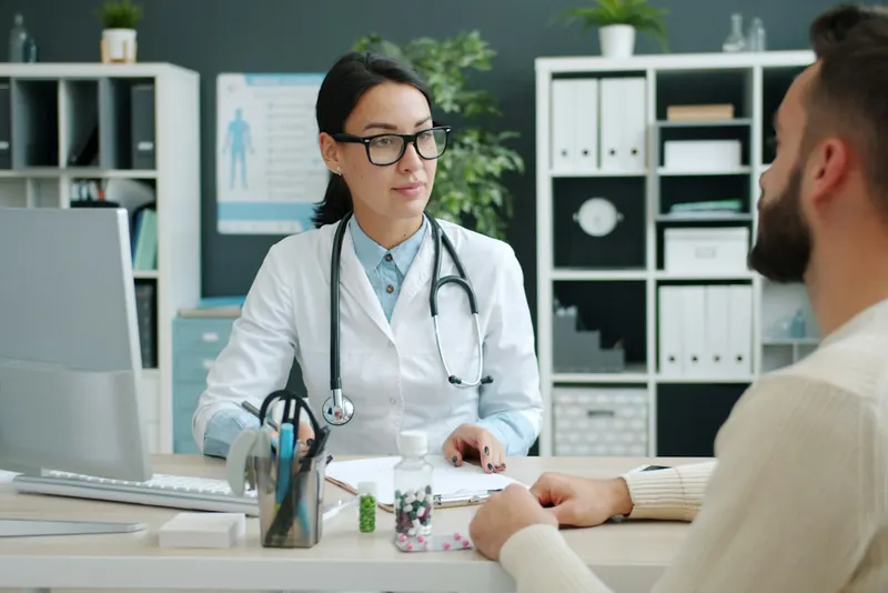 Doctor meeting with a patient in a clinic
