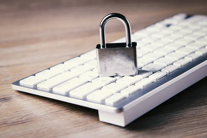 Padlock resting on a laptop keyboard